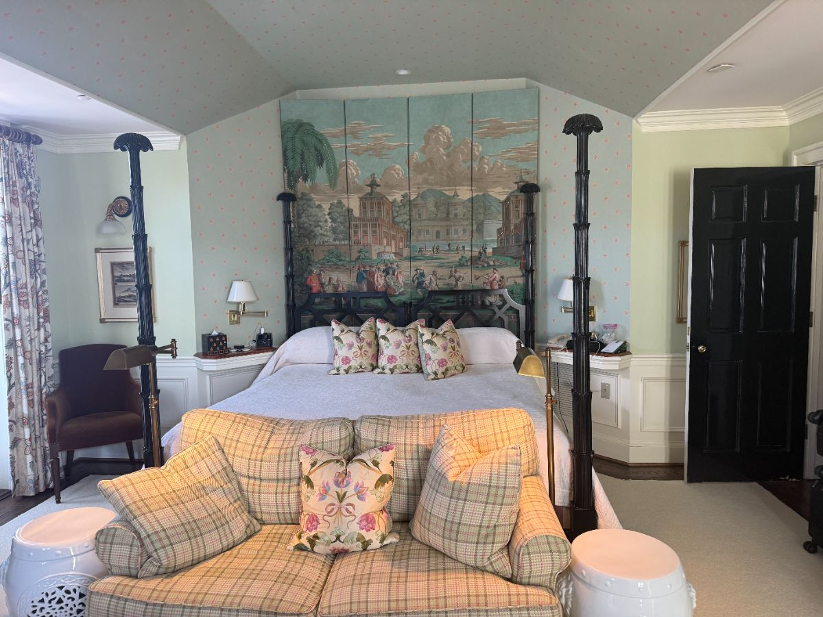 The Jacques Pépin room, with its hand-painted headboard and four-poster bed.
