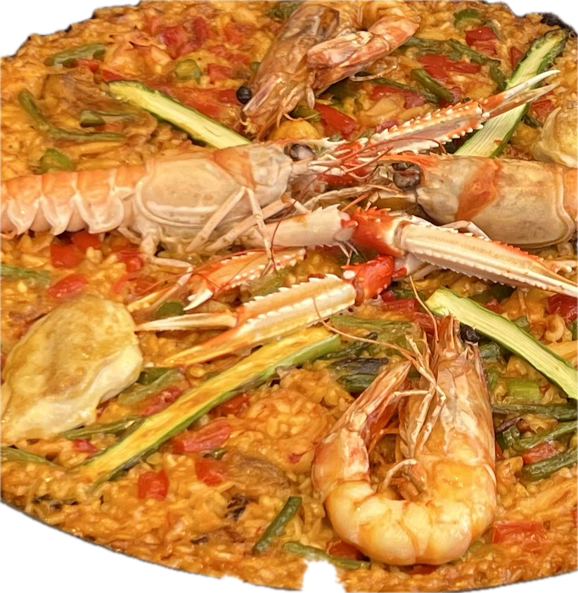A carbon-steel paellera, the traditional pan of the Valencian countryside.