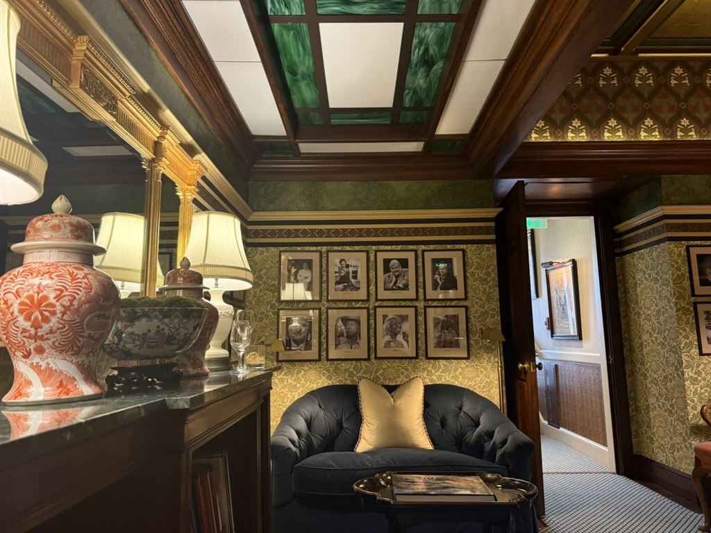 The wall of chef portraits — the pantheon the Inn's rooms are named for.